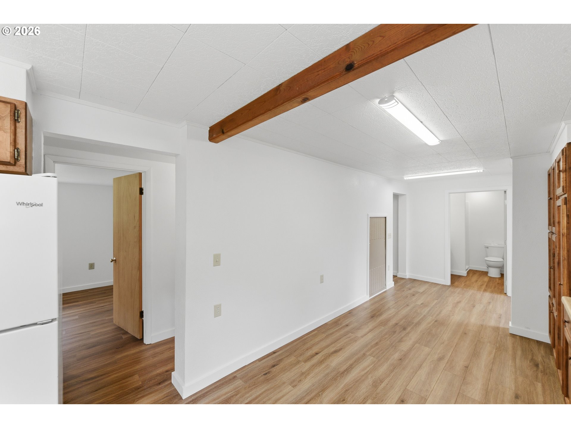 63299 Wildahl Road Coos Bay, OR 97420 - Photo 26 of 45 a view of an empty room with wooden floor