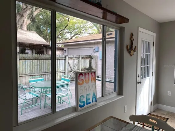 a view of a porch with a floor to ceiling window
