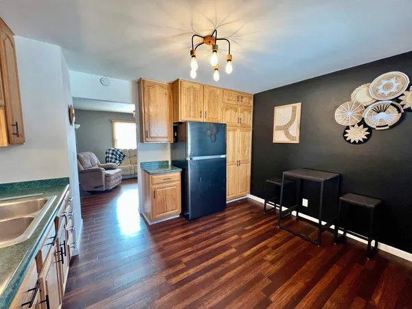 a kitchen with refrigerator a microwave oven a sink and dishwasher