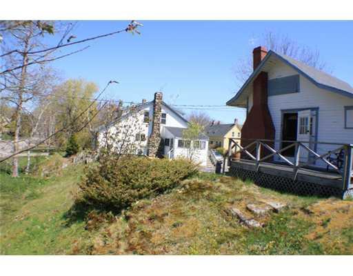 1689 Harpswell Islands Road Orrs Island, ME 04066 - Photo 2 of 77 Exterior Front. Natural landscaping...