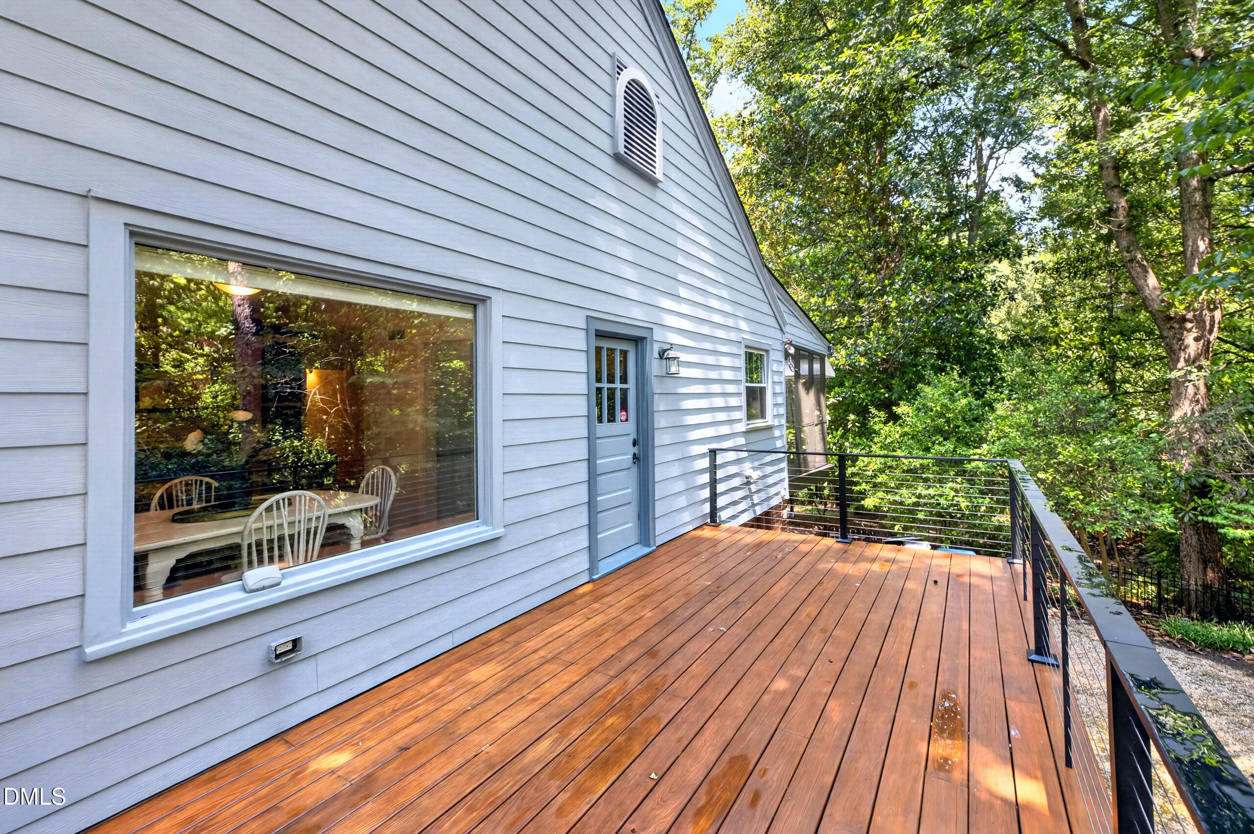 2248 Cranford Road Durham, NC 27705 - Photo 8 of 42 Dining table looks out to deck and woods