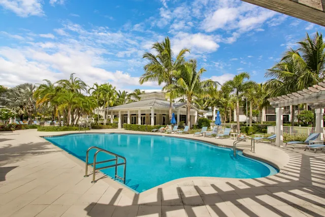a view of a patio with swimming pool table and chairs