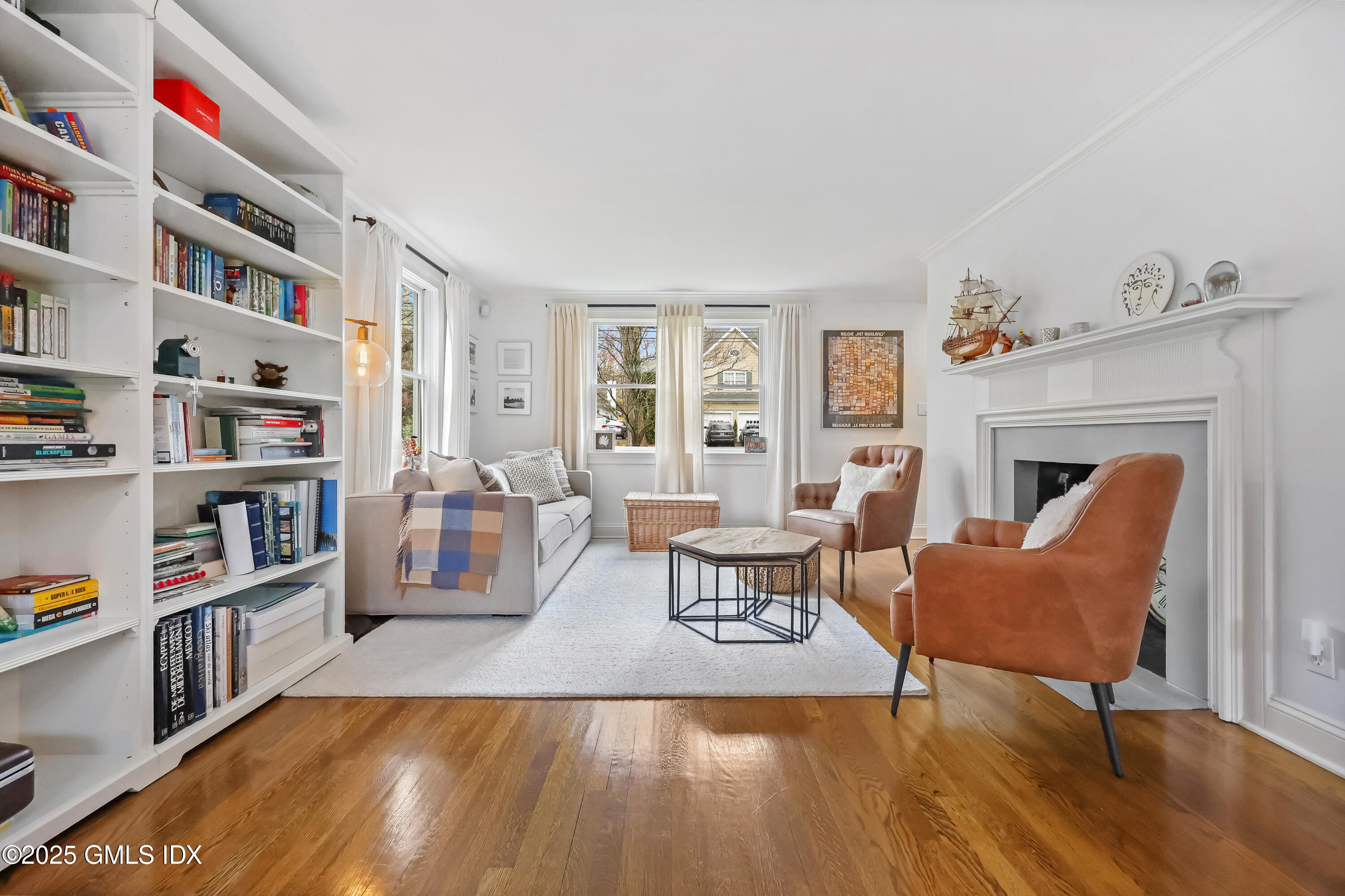 22 Summit Road Riverside, CT 06878 - Photo 13 of 44 a living room with furniture and a book shelf