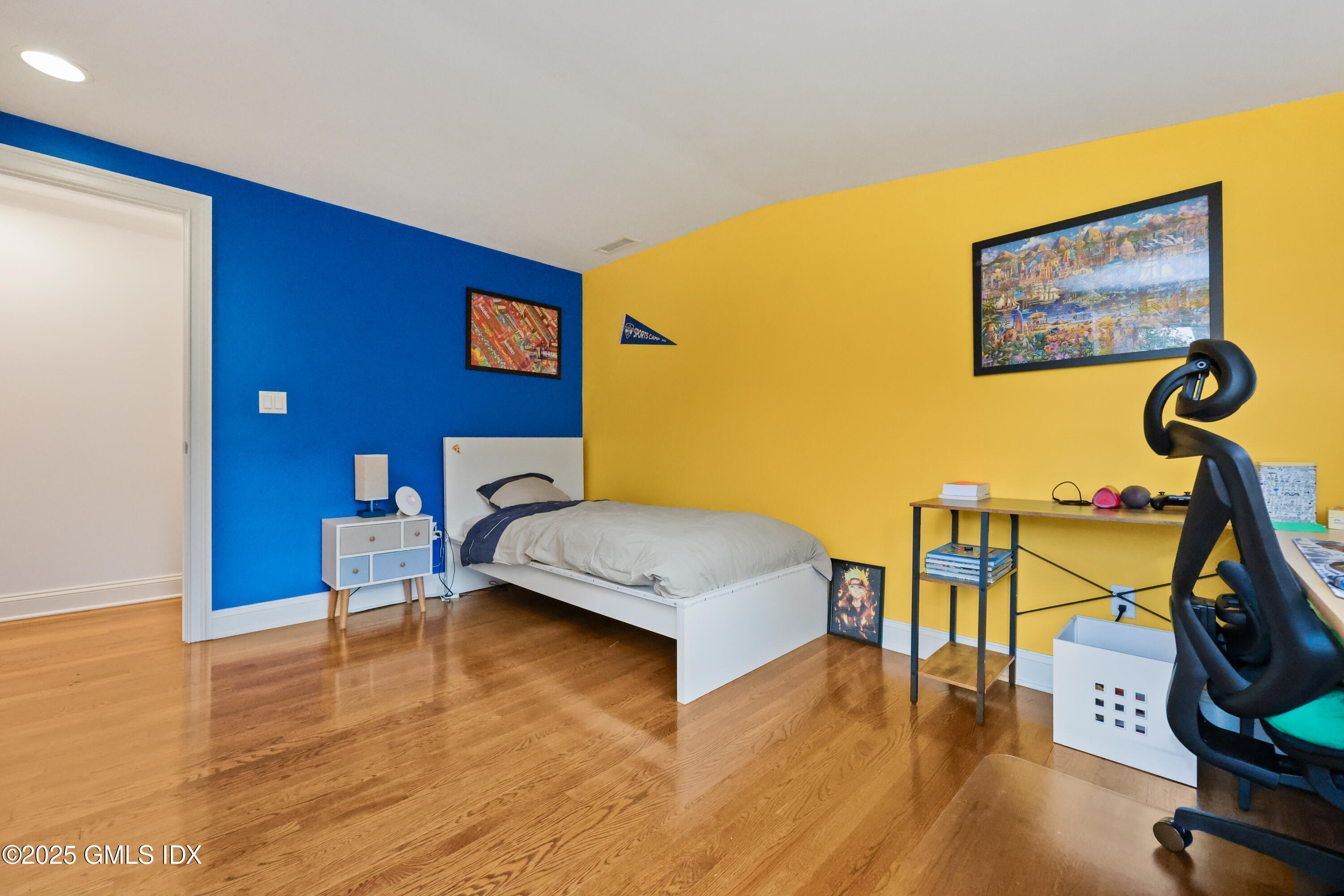 22 Summit Road Riverside, CT 06878 - Photo 26 of 44 a bedroom with a bed and wooden floor