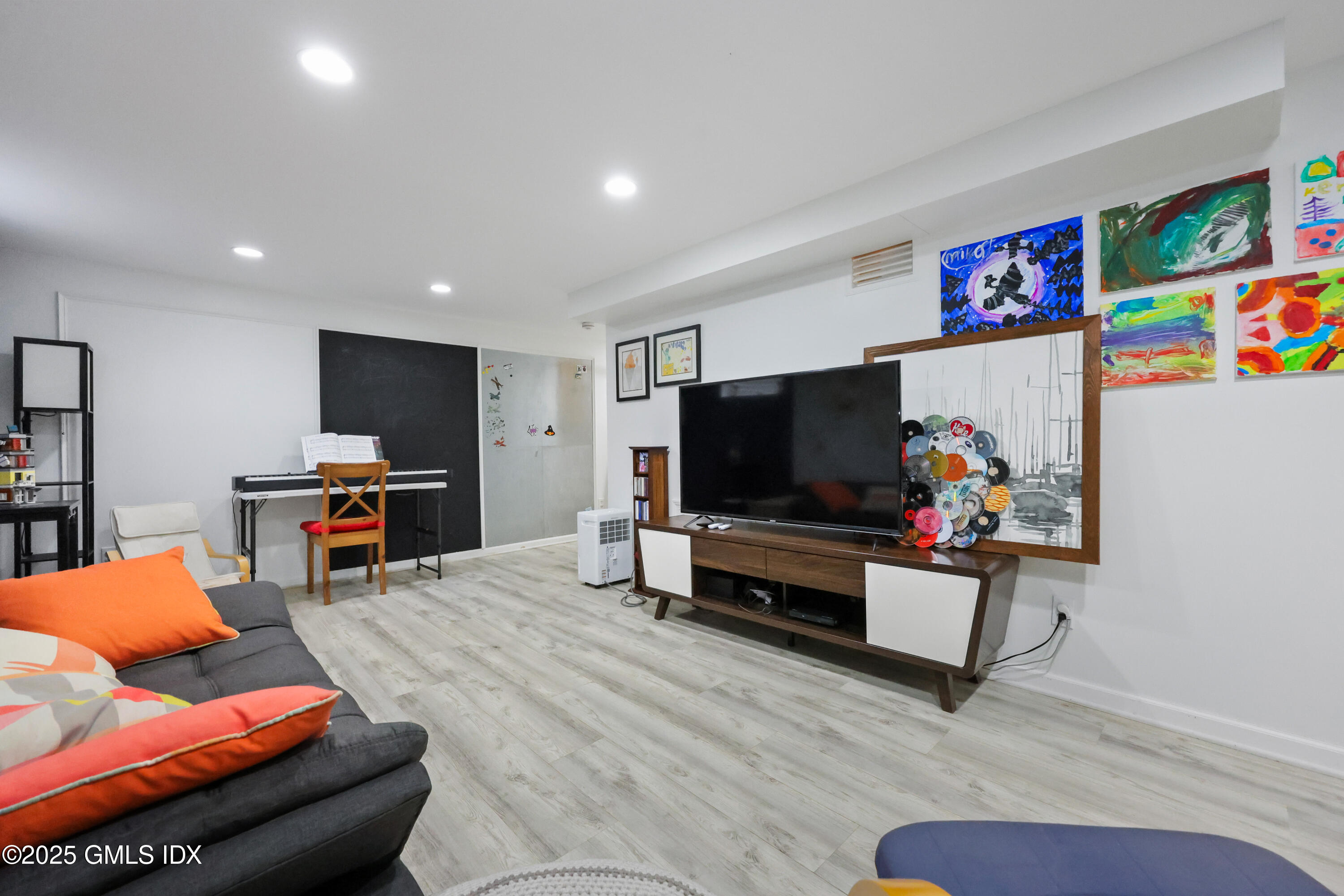 22 Summit Road Riverside, CT 06878 - Photo 32 of 44 a living room with furniture and a flat screen tv