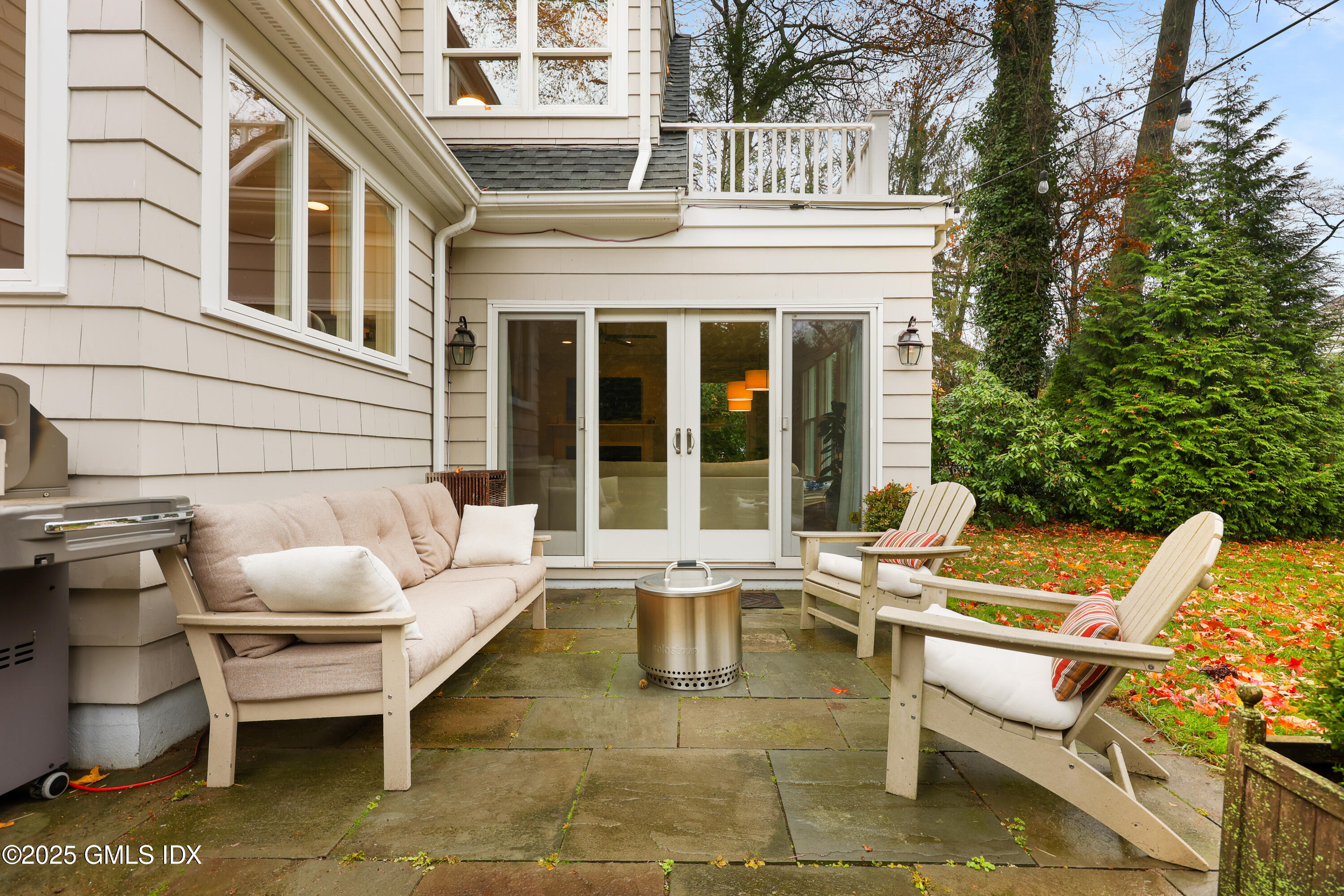 22 Summit Road Riverside, CT 06878 - Photo 33 of 44 a view of a patio with couches table and chairs and potted plants