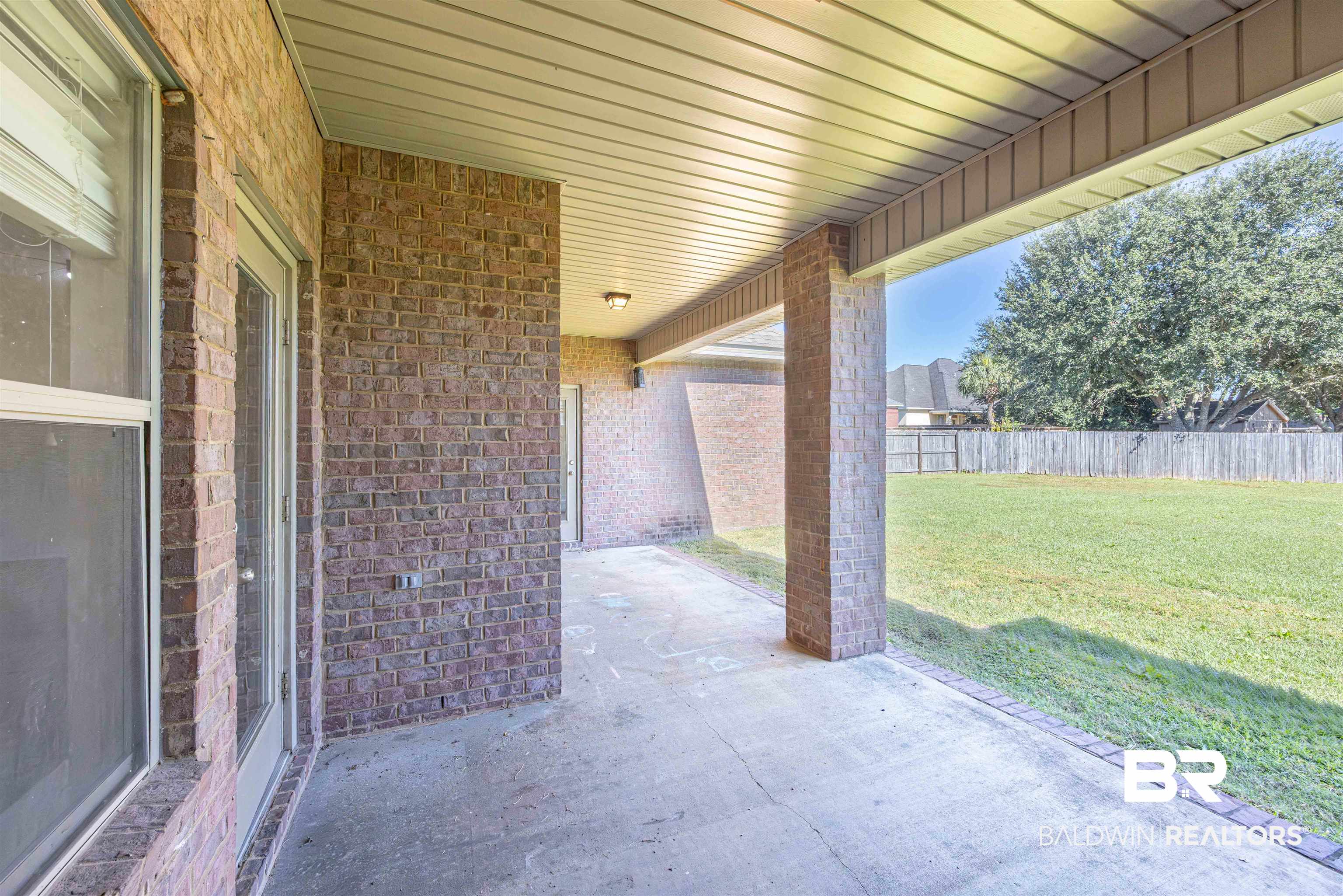 25234 Fairfax Road Daphne, AL 36526 - Photo 32 of 45 Fenced backyard with a patio area