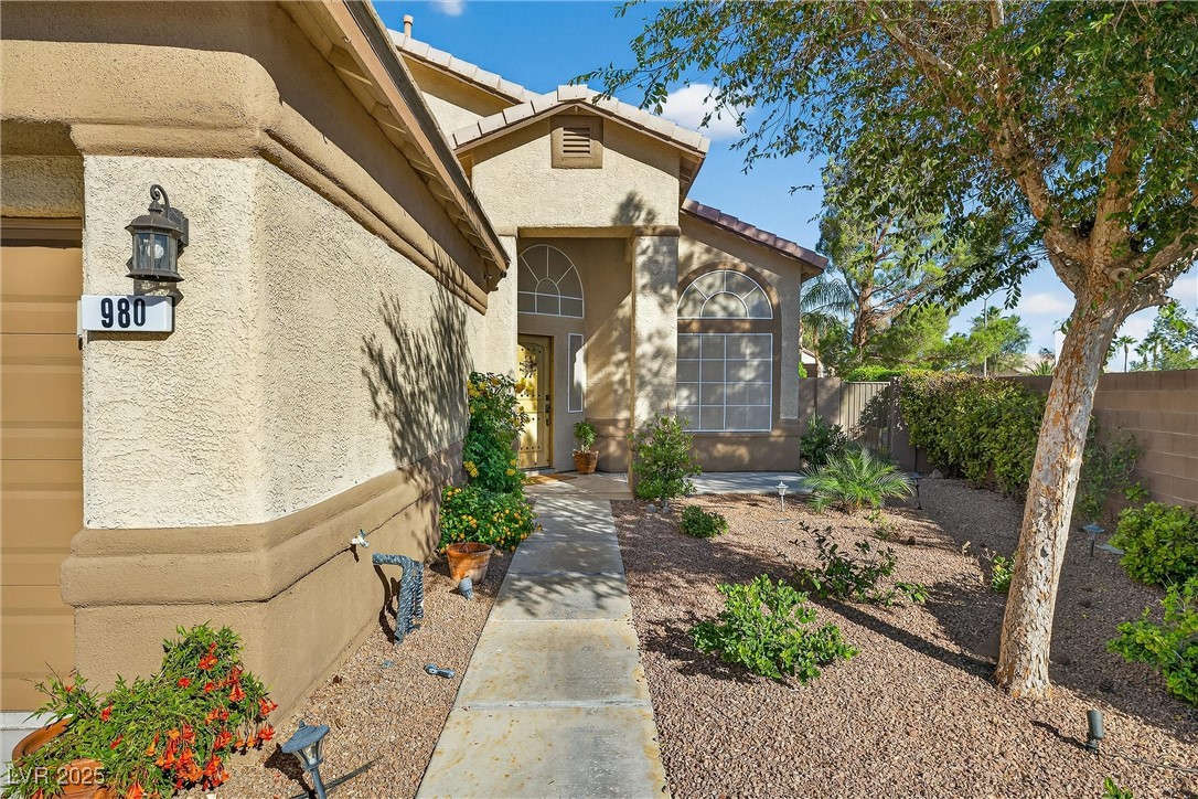 980 Upper Meadows Place Henderson, NV 89052 - Photo 12 of 58 Doorway to property with stucco siding