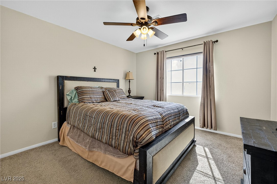 980 Upper Meadows Place Henderson, NV 89052 - Photo 42 of 58 Carpeted bedroom with baseboards and a ceiling fan
