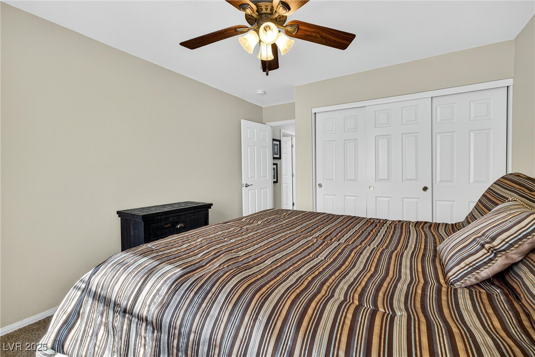 980 Upper Meadows Place Henderson, NV 89052 - Photo 43 of 58 Carpeted bedroom featuring a closet and ceiling fan