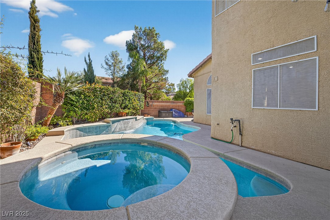 980 Upper Meadows Place Henderson, NV 89052 - Photo 46 of 58 View of pool with a fenced backyard, a patio, and a pool with connected hot tub