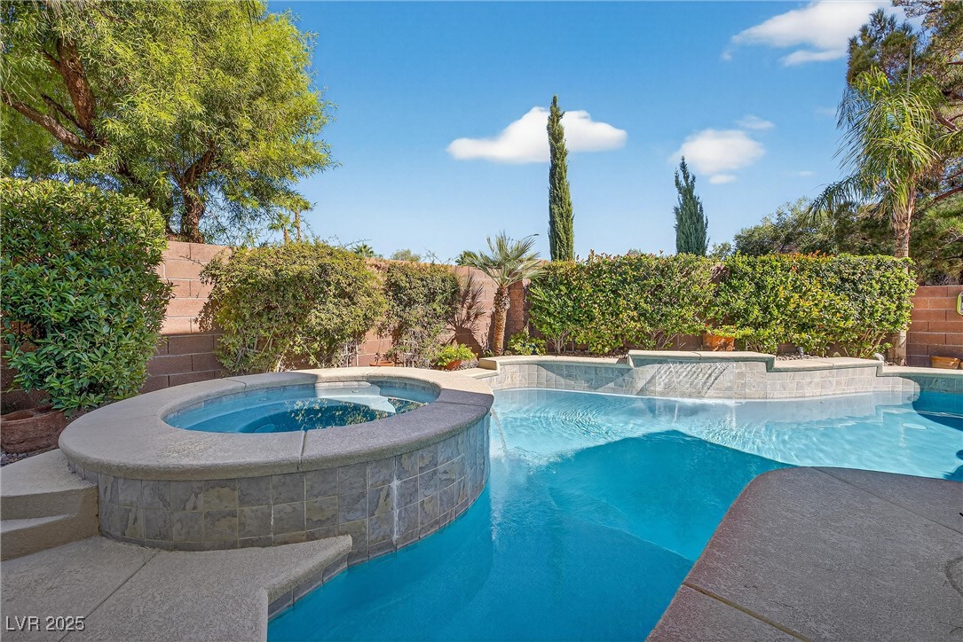 980 Upper Meadows Place Henderson, NV 89052 - Photo 47 of 58 View of swimming pool featuring a fenced backyard, a patio area, and a pool with connected hot tub