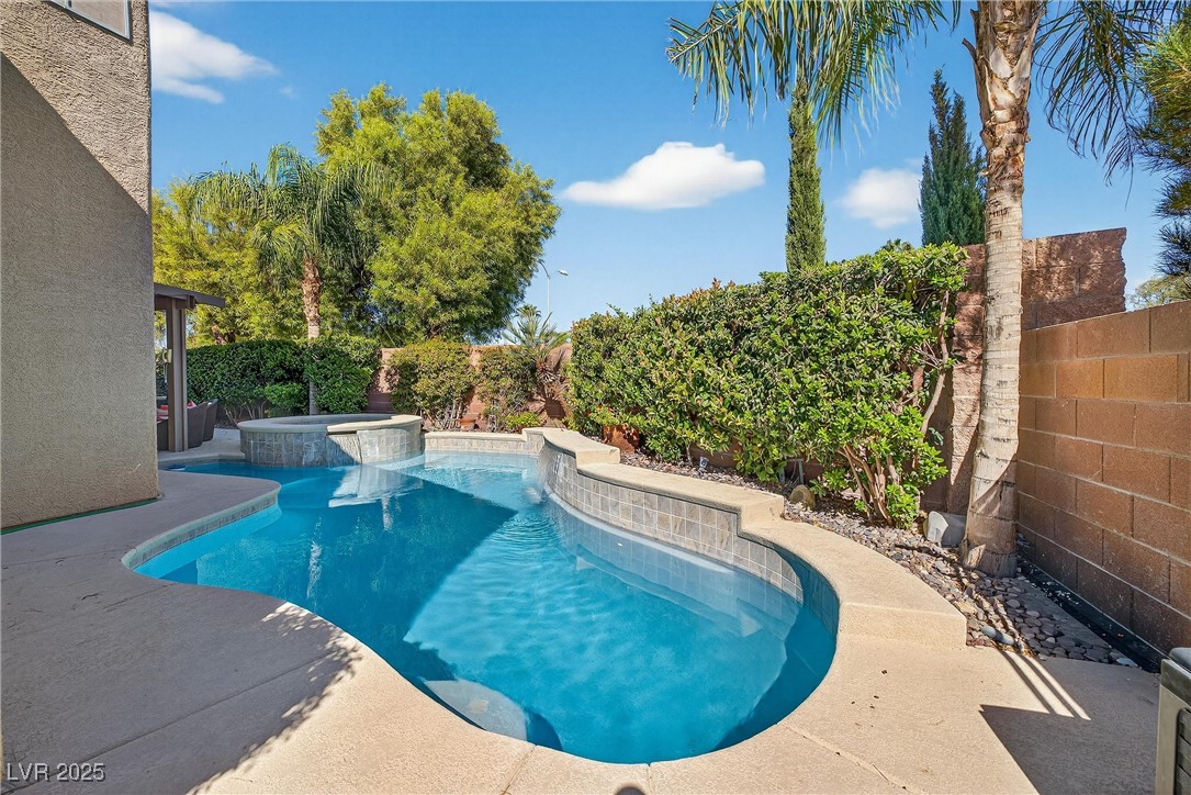 980 Upper Meadows Place Henderson, NV 89052 - Photo 49 of 58 View of pool with a fenced backyard, a patio, and a pool with connected hot tub