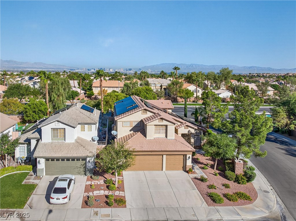 980 Upper Meadows Place Henderson, NV 89052 - Photo 53 of 58 Aerial perspective of suburban area featuring a mountain backdrop