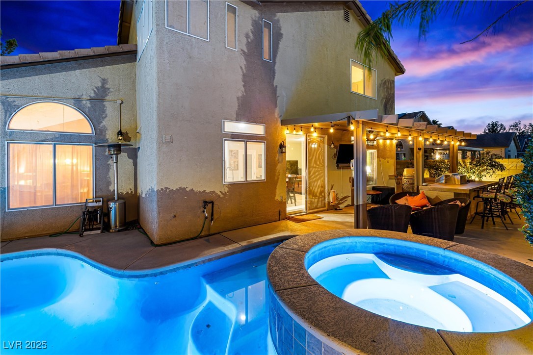 980 Upper Meadows Place Henderson, NV 89052 - Photo 6 of 58 View of swimming pool featuring a patio, a pergola, and a pool with connected hot tub