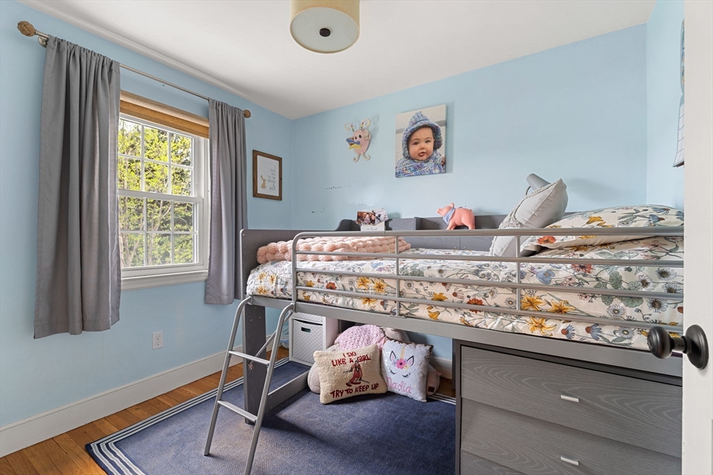 28 Waterside Road Marblehead, MA 01945 - Photo 23 of 40 a bedroom with a bed and wooden floor