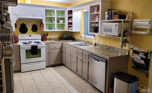 a kitchen with a stove and a refrigerator