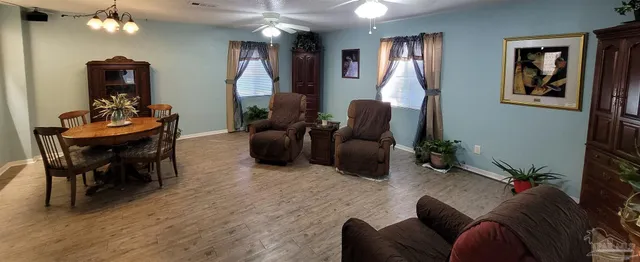 a bed sitting in a bedroom and mirror