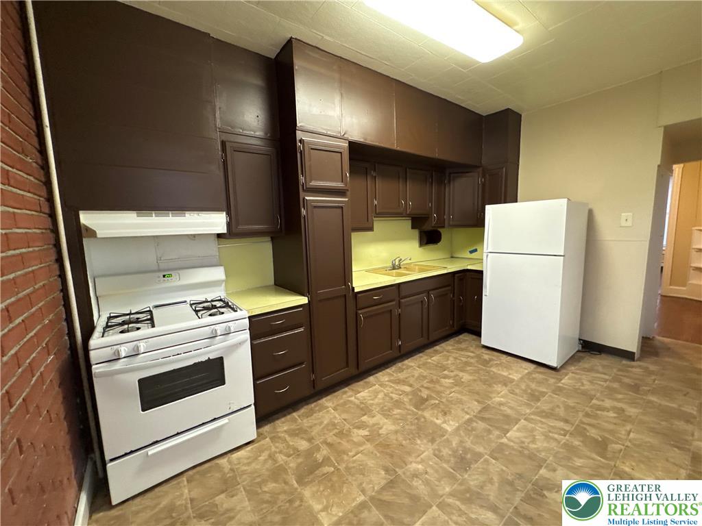 229 West Fairview Street Bethlehem, PA 18018 - Photo 12 of 17 a kitchen with a stove and a refrigerator