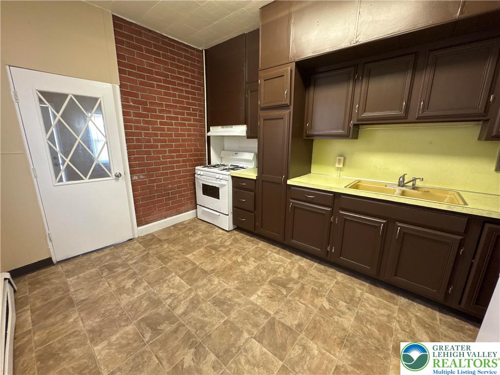 229 West Fairview Street Bethlehem, PA 18018 - Photo 13 of 17 a kitchen with sink cabinets and window