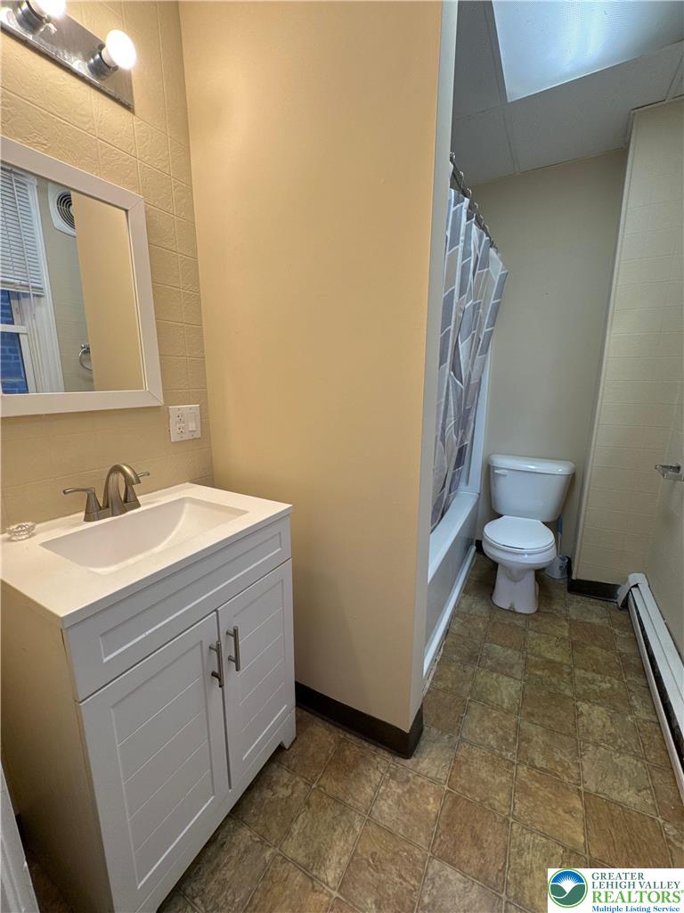 229 West Fairview Street Bethlehem, PA 18018 - Photo 14 of 17 a bathroom with a sink a toilet and a mirror