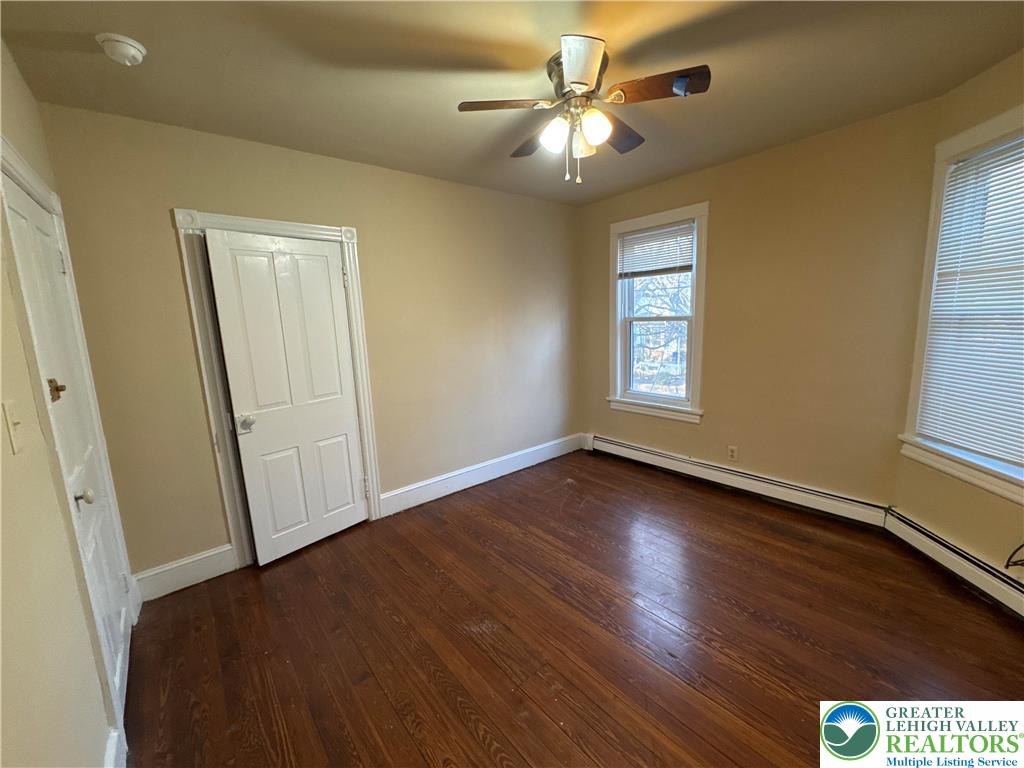 229 West Fairview Street Bethlehem, PA 18018 - Photo 17 of 17 an empty room with wooden floor and windows