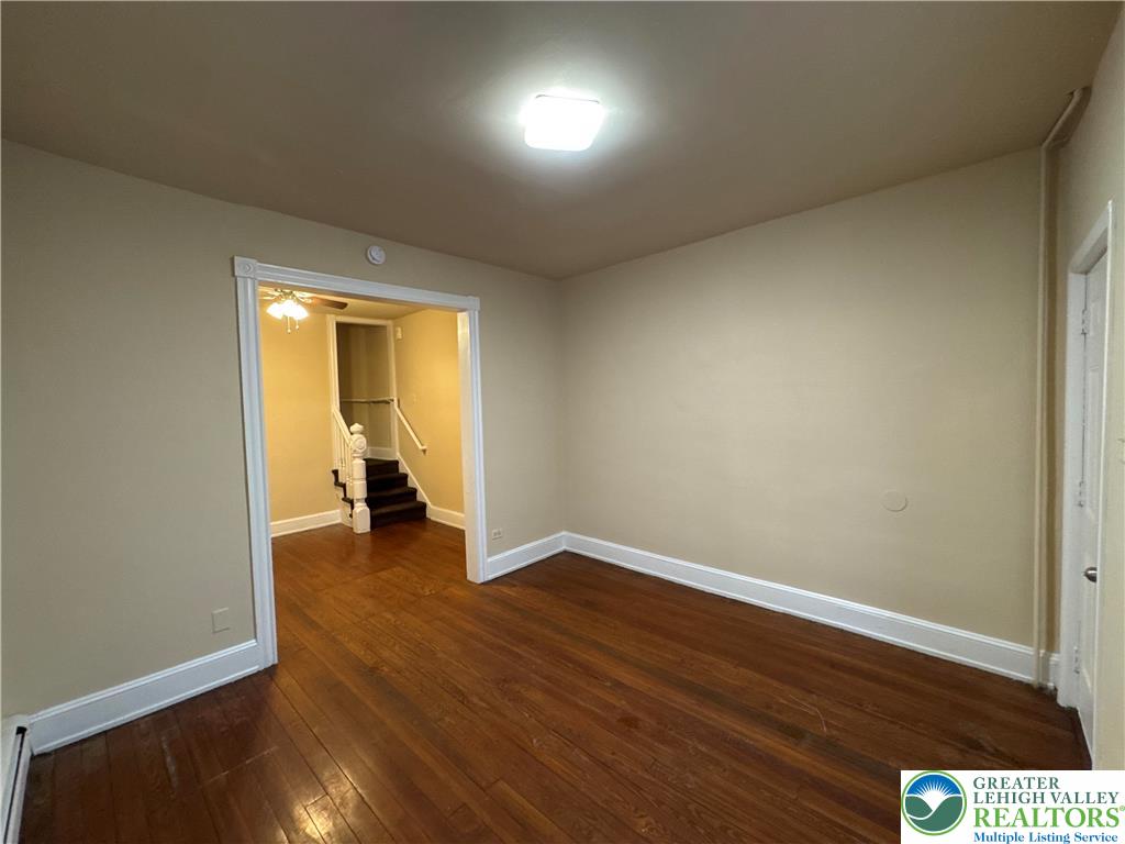 229 West Fairview Street Bethlehem, PA 18018 - Photo 7 of 17 an empty room with wooden floor and a window