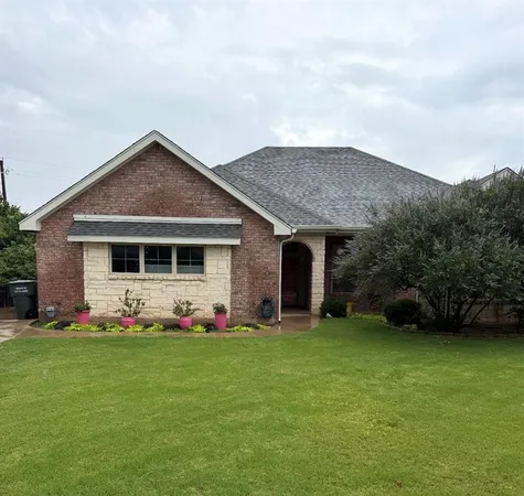 a front view of house with garden