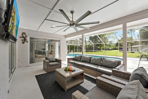 a living room with furniture and a large window