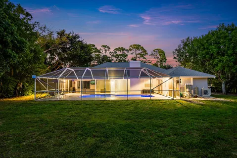 a view of a house with a big yard
