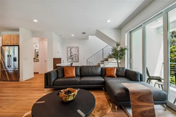 a living room with furniture and a large window