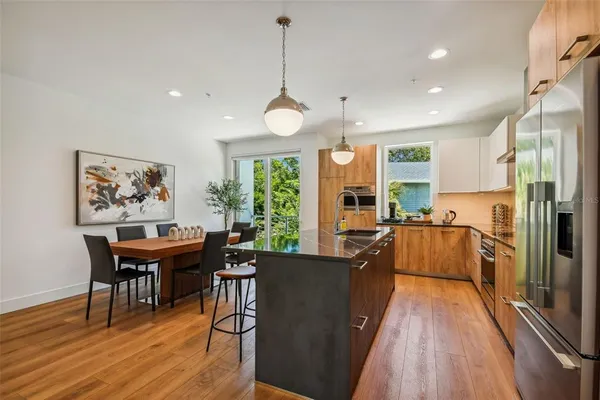 a view of a dining room with furniture window and wooden floor