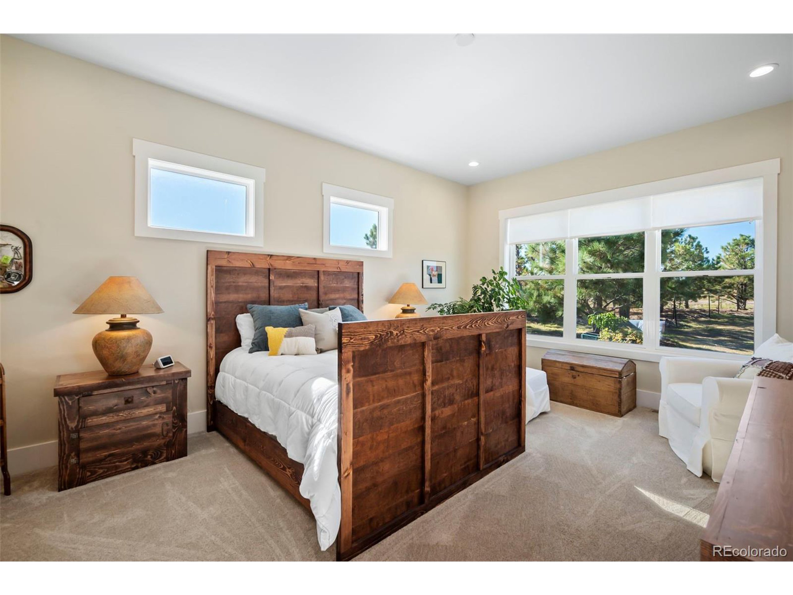 4694 Settlers Ridge Road Colorado Springs, CO 80908 - Photo 12 of 43 a bed room with a bed and a large window