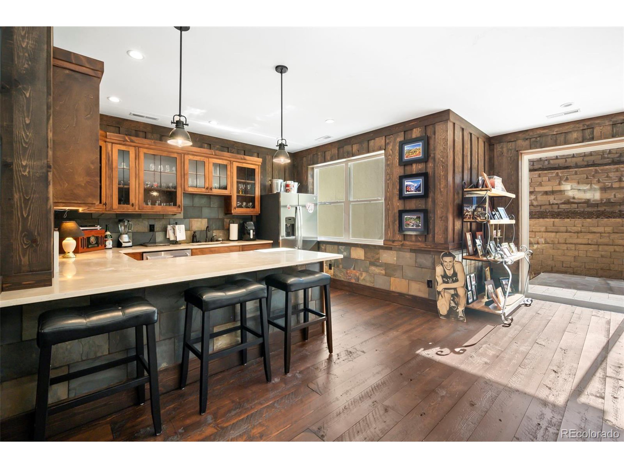 4694 Settlers Ridge Road Colorado Springs, CO 80908 - Photo 23 of 43 a open kitchen with a table and chairs