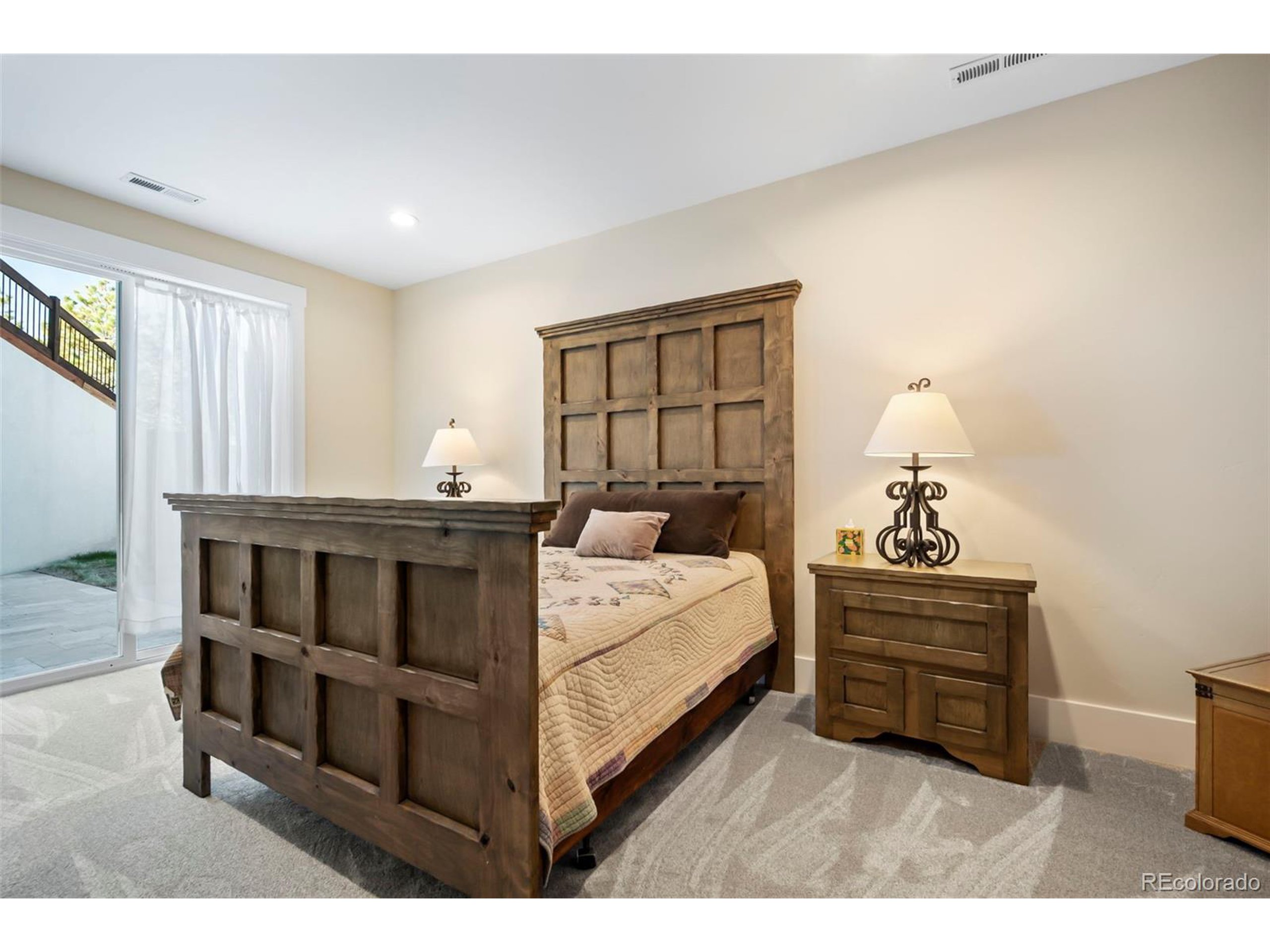 4694 Settlers Ridge Road Colorado Springs, CO 80908 - Photo 29 of 43 a bedroom with a bed and a window