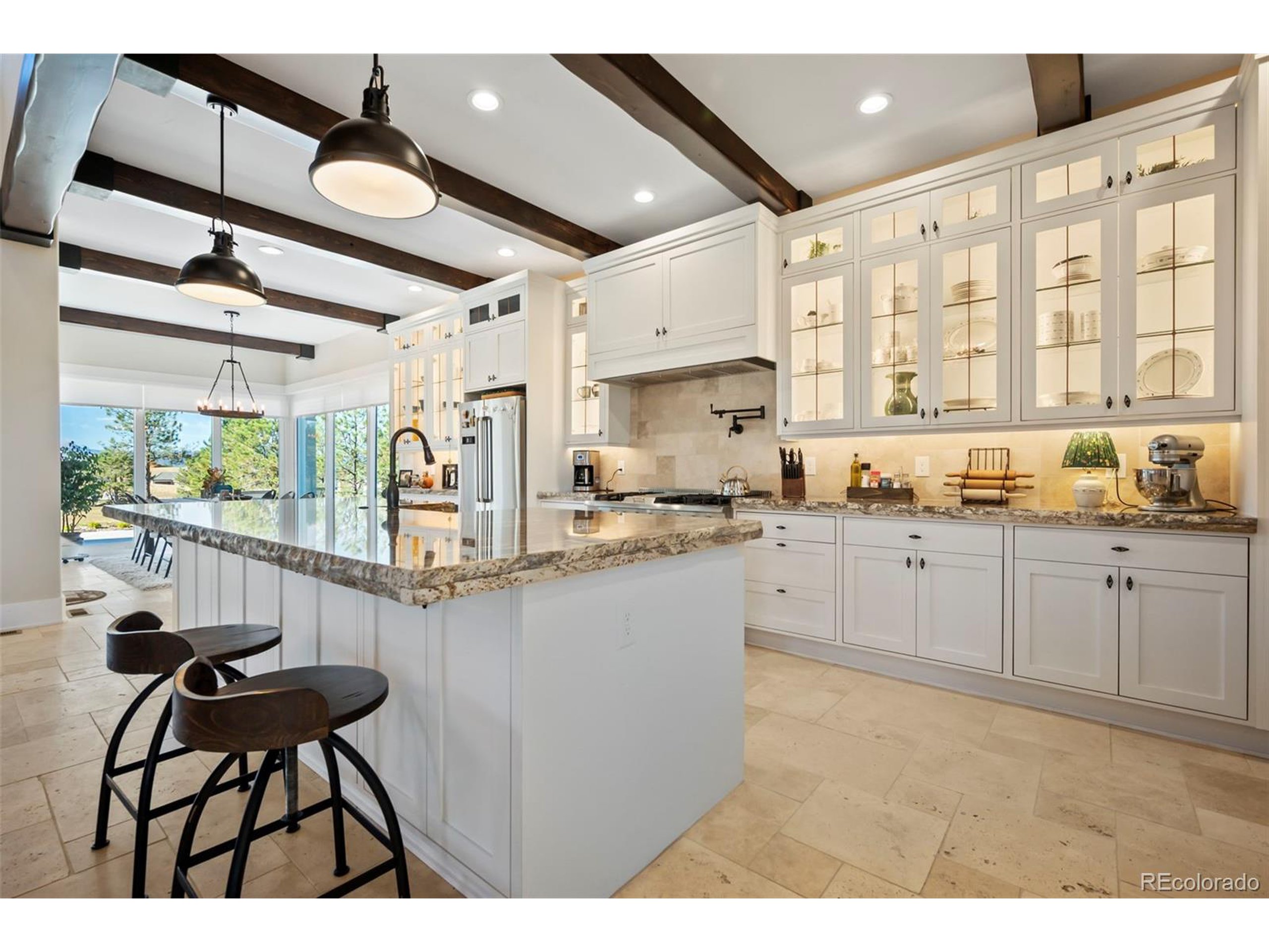 4694 Settlers Ridge Road Colorado Springs, CO 80908 - Photo 31 of 43 a kitchen with cabinets a sink and appliances