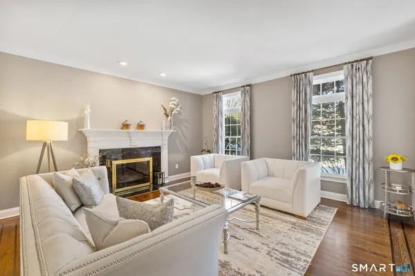 a living room with furniture and a fireplace