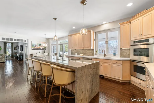 a kitchen with stainless steel appliances granite countertop counter space a sink and cabinets