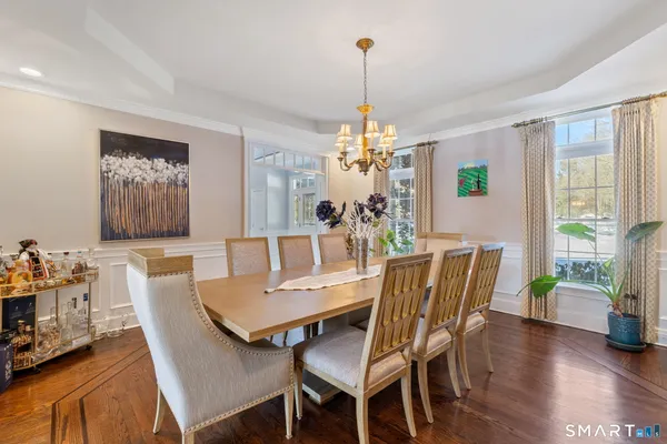 a view of a dining room with furniture window and wooden floor