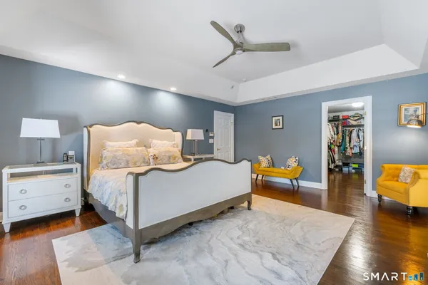 a bedroom with a bed and a couch