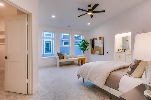 a spacious bedroom with a bed and furniture