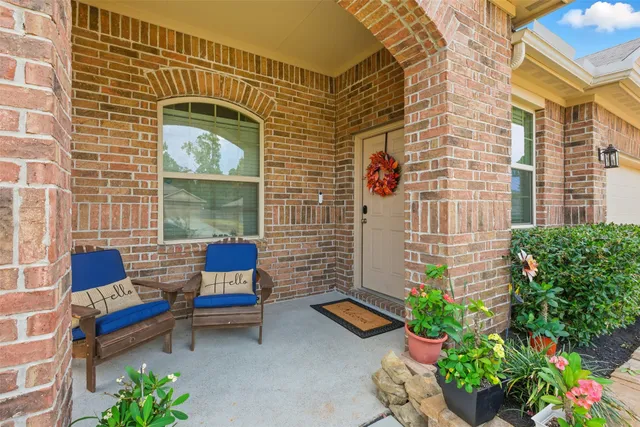 a front view of a house with outdoor seating