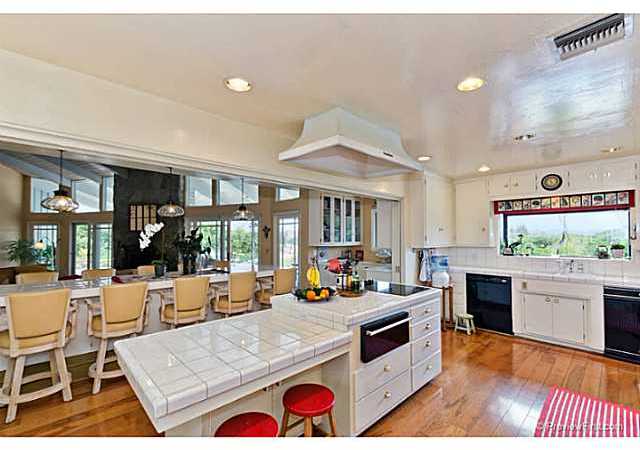 530 Georgine Road Fallbrook, CA 92028 - Photo 11 of 25 Island has breakfast bar. Hooded cooktop, warming drawer, dishwasher, trash compactor.