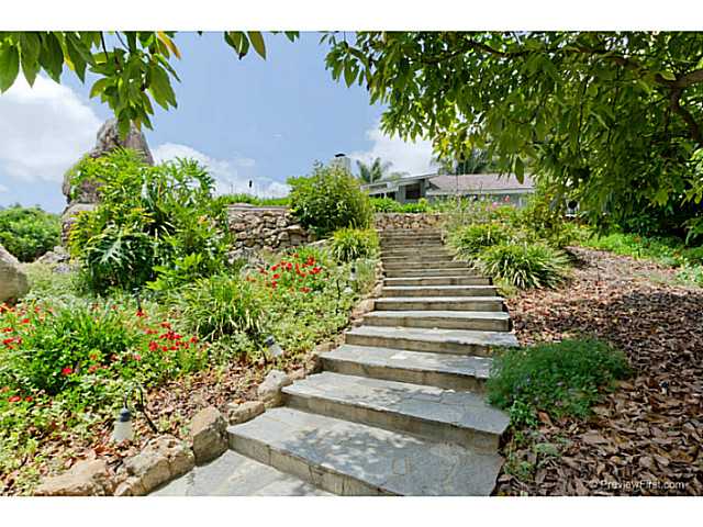 530 Georgine Road Fallbrook, CA 92028 - Photo 21 of 25 Beautiful mature landscaping is on automatic sprinkler system. Flagstone steps connect the upper patio to the firepit BBQ below.