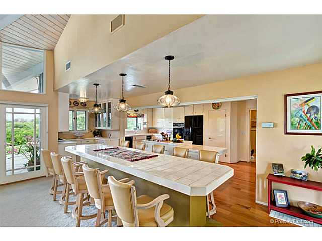 530 Georgine Road Fallbrook, CA 92028 - Photo 10 of 25 Custom dining table has lots of storage underneath.