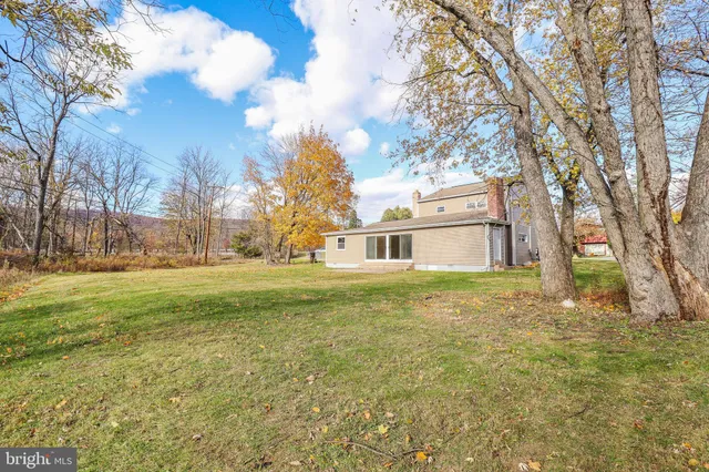 a view of an empty room and wooden floor