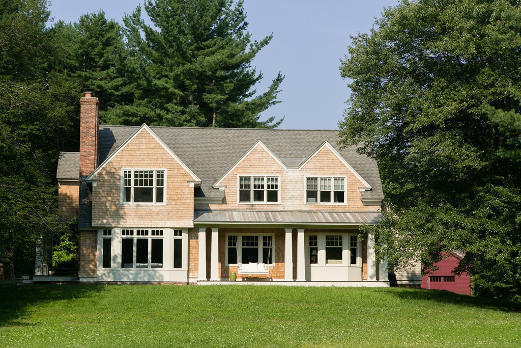 73 Weston Road Lincoln, MA 01773 - Photo 1 of 30 a front view of a house with a garden
