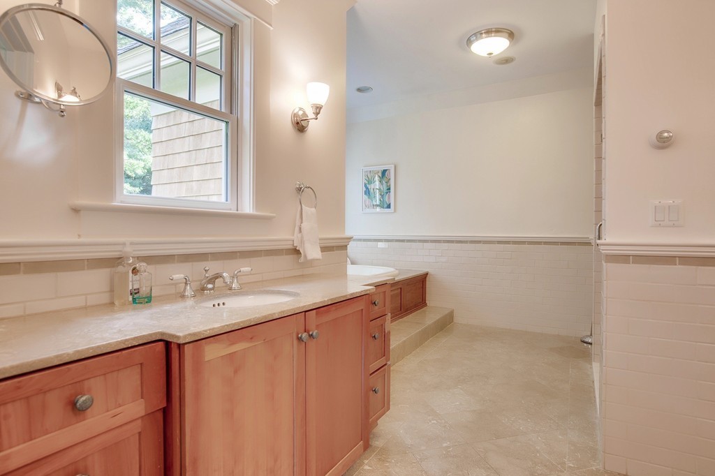73 Weston Road Lincoln, MA 01773 - Photo 18 of 30 a bathroom with a sink and a mirror