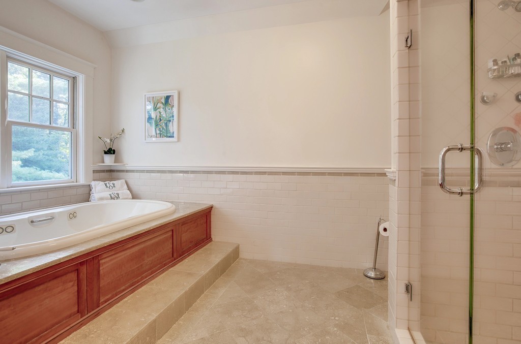 73 Weston Road Lincoln, MA 01773 - Photo 19 of 30 a spacious bathroom with a tub sink and mirror