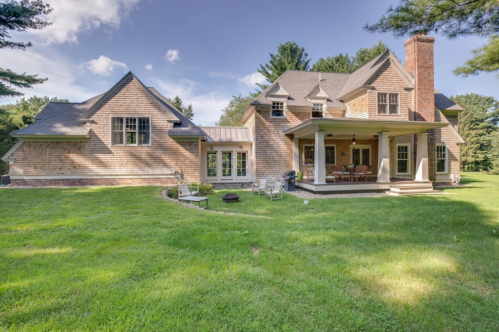 73 Weston Road Lincoln, MA 01773 - Photo 2 of 30 a front view of a house with a yard and green space